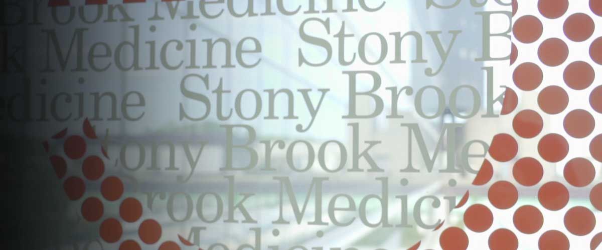 frosted glass window with multiple versions of the Stony Brook Medicine logo