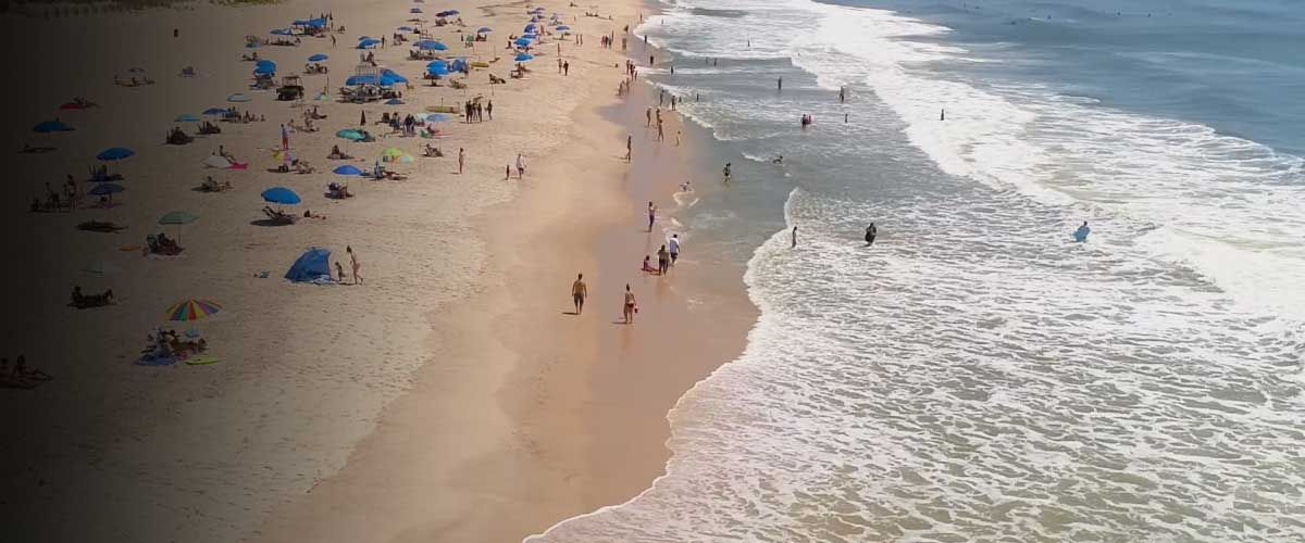 an overhead image of a sunny summer day at the beach