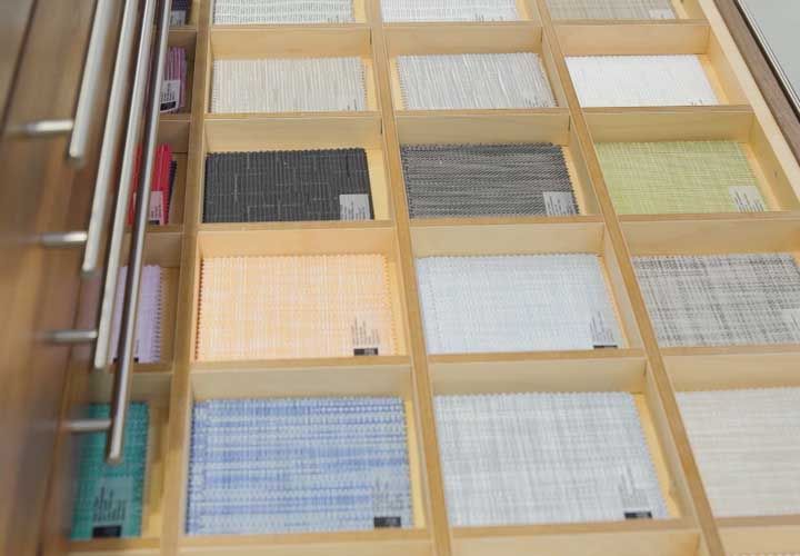 multo colored fabric samples in a drawer